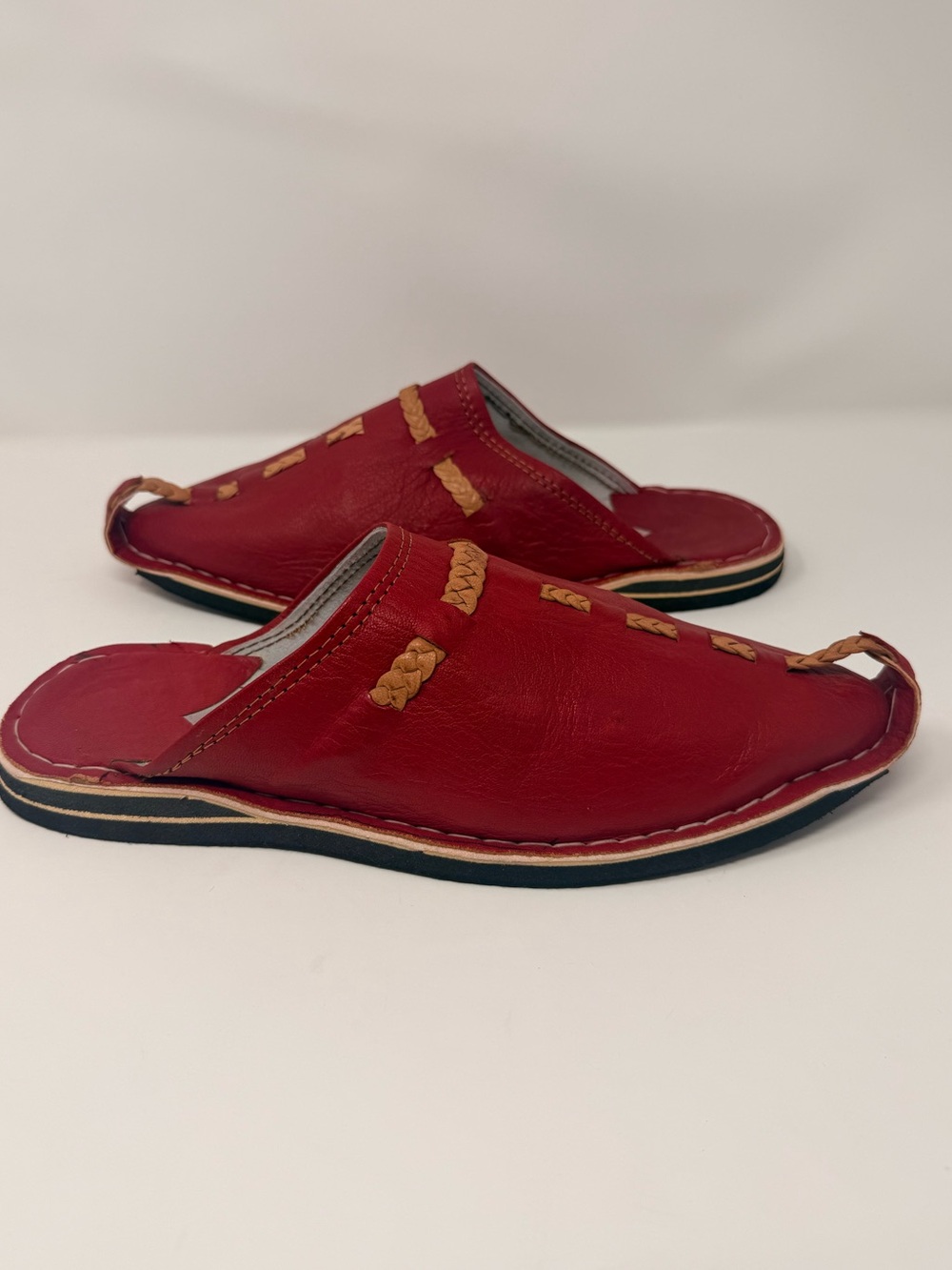 Men's Red Leather Moroccan babouche slippers featuring woven decorative stitchin